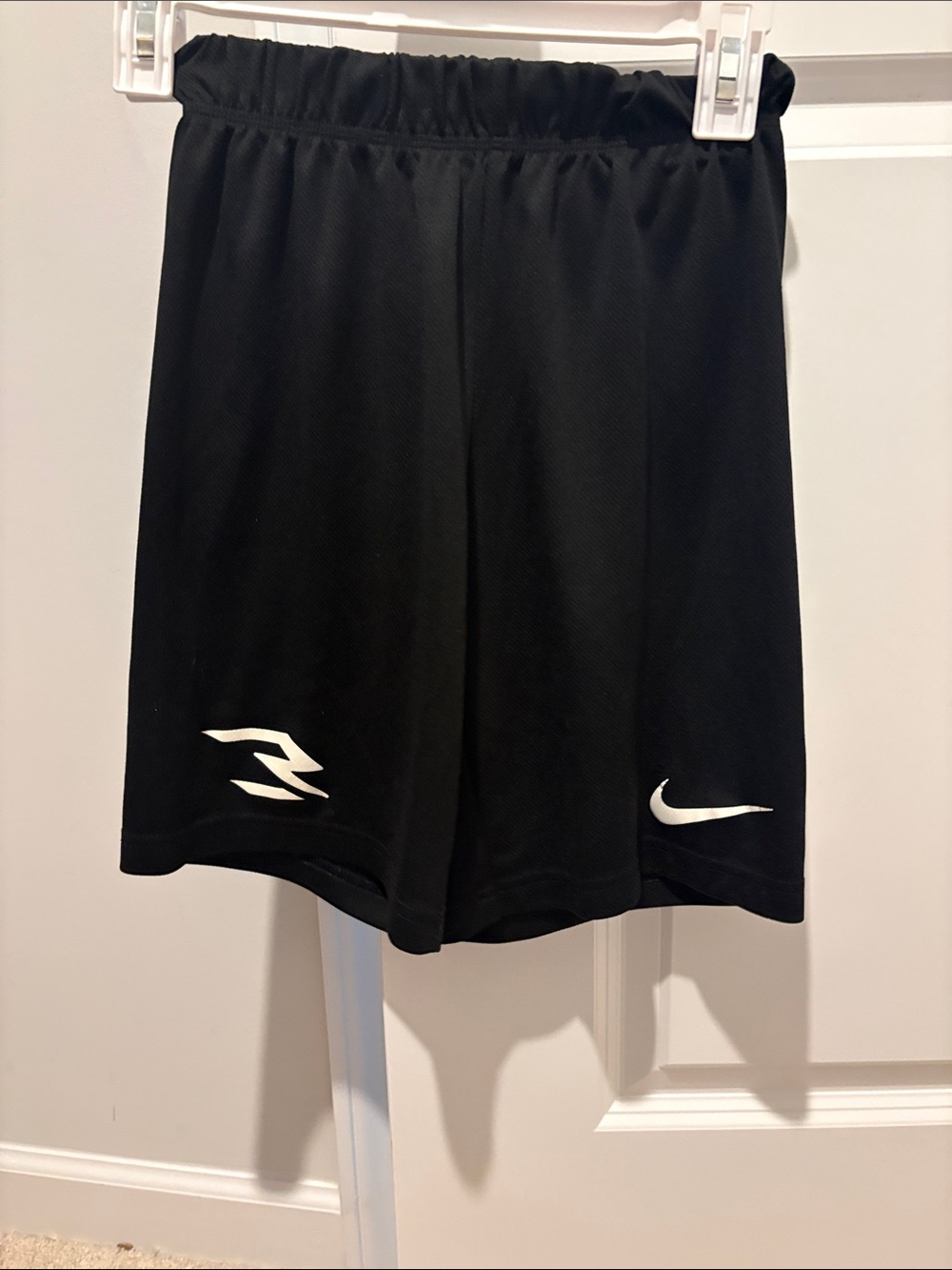 Nike Black Athletic Shorts with White Swoosh and Logo